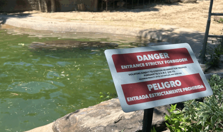 Danger sign next to water feature